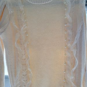 Cream, soft sweater with Lace ruffle detail and pearl detail in front